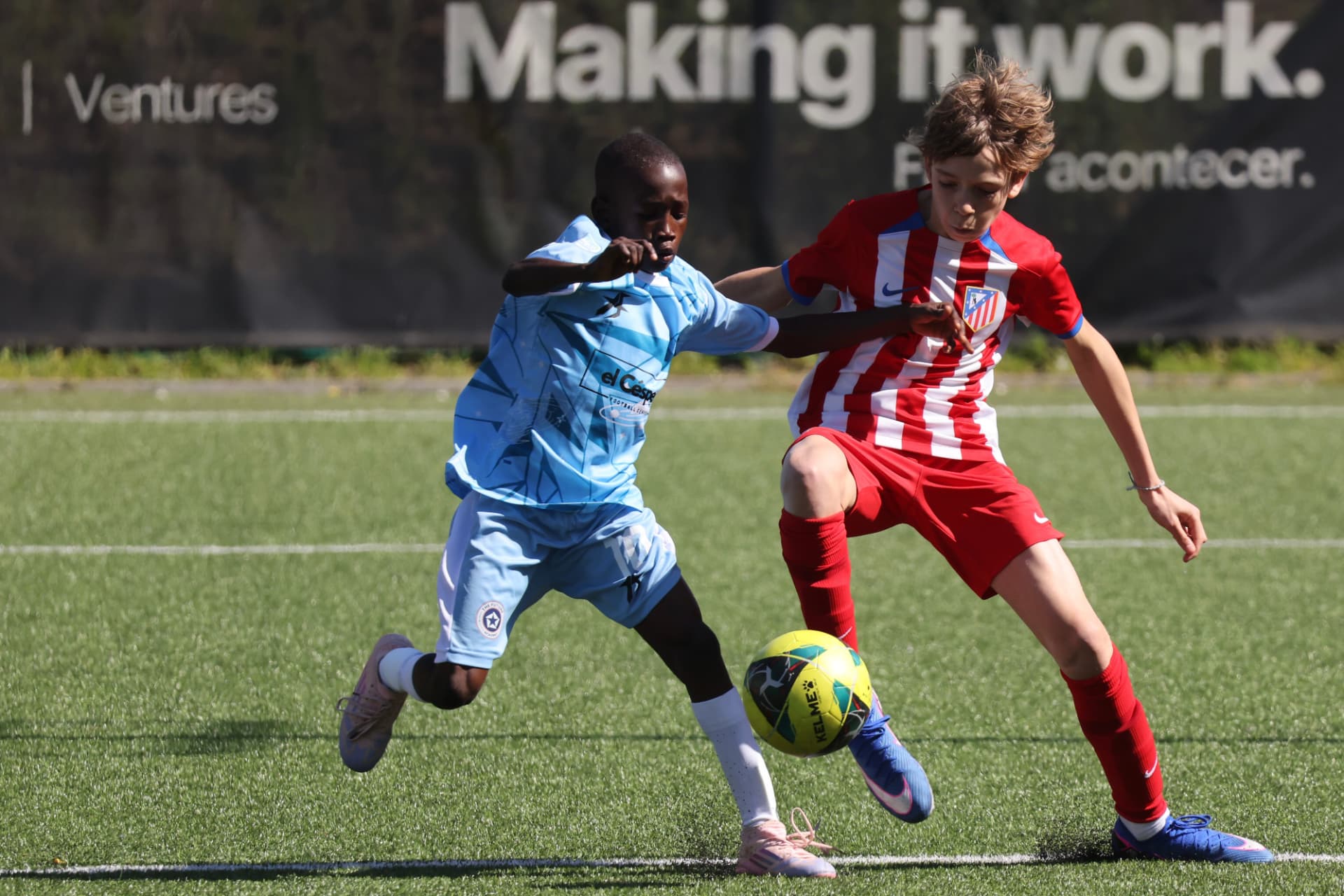 Two players fighting for the ball